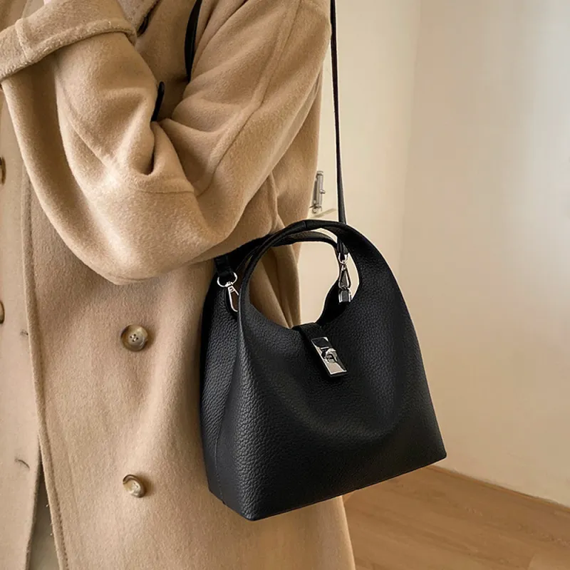 Storm Small Crossbody Bag With Detachable Bag Charm in Black made by XYlondon