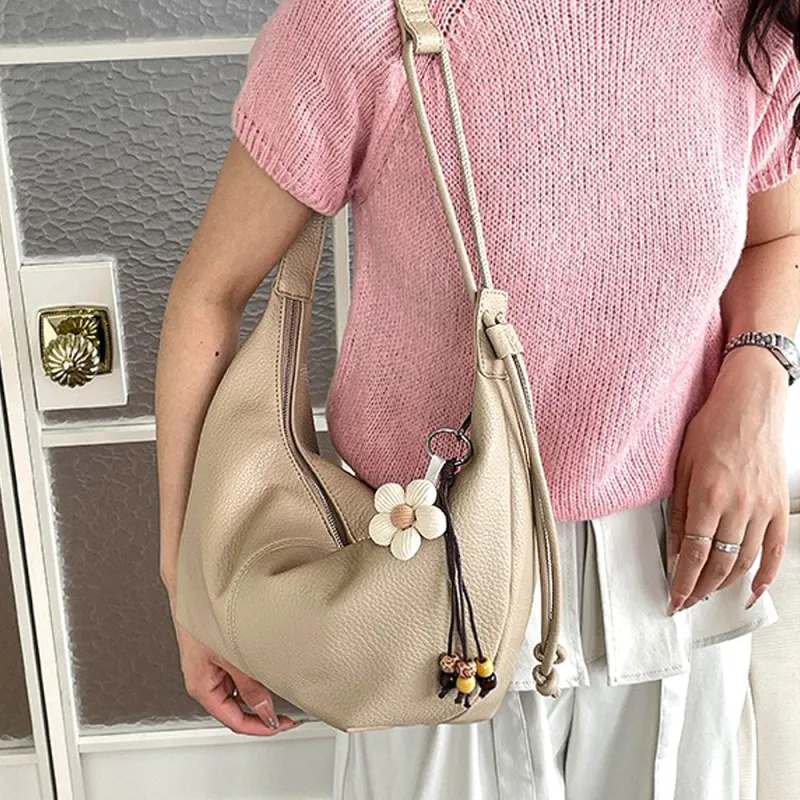 Calla Faux Leather Crescent Shoulder Handbag With Crossbody Strap in Beige made by XYlondon