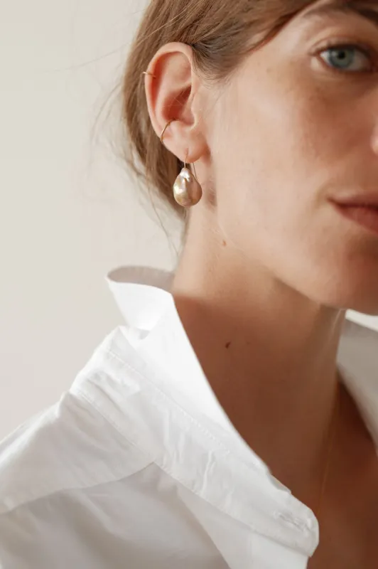 The June Pink Pearl Drop Earrings sold by DONNI.