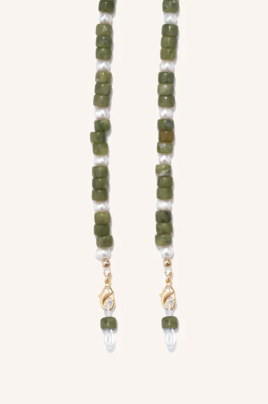 gem + pearl mask/sunny chain sold by DONNI.