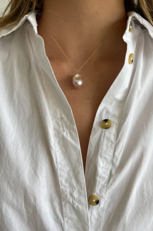 The June 16" Pink Pearl Necklace sold by DONNI.