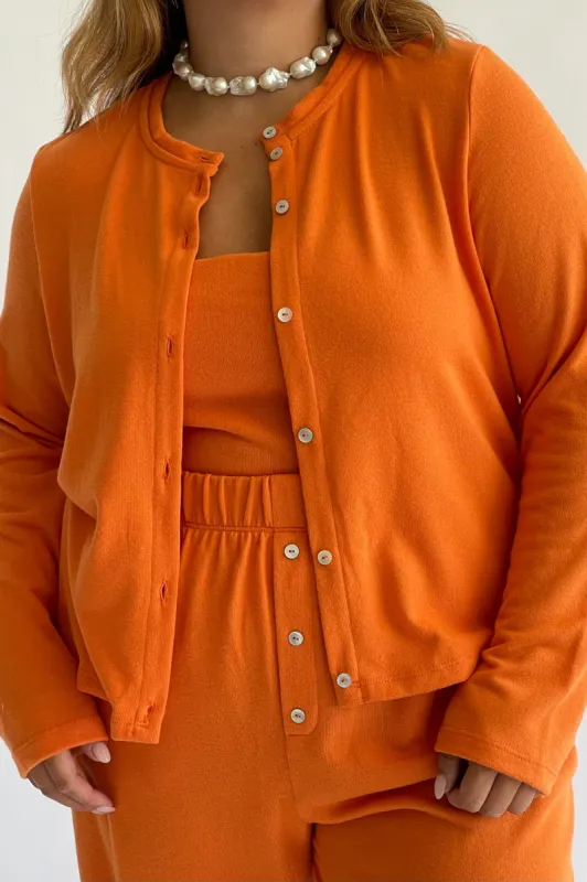 sweater cardi sold by DONNI.