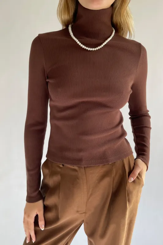 rib turtleneck sold by DONNI.
