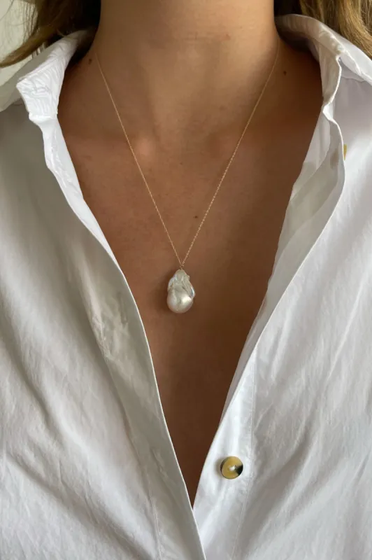 The June 20" White Pearl Necklace sold by DONNI.