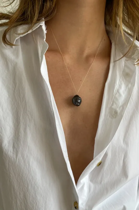 The June 20" Black Pearl Necklace sold by DONNI.