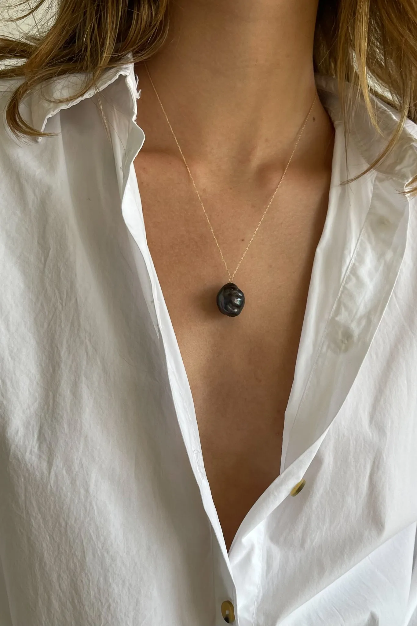 The June 20" Black Pearl Necklace sold by DONNI.