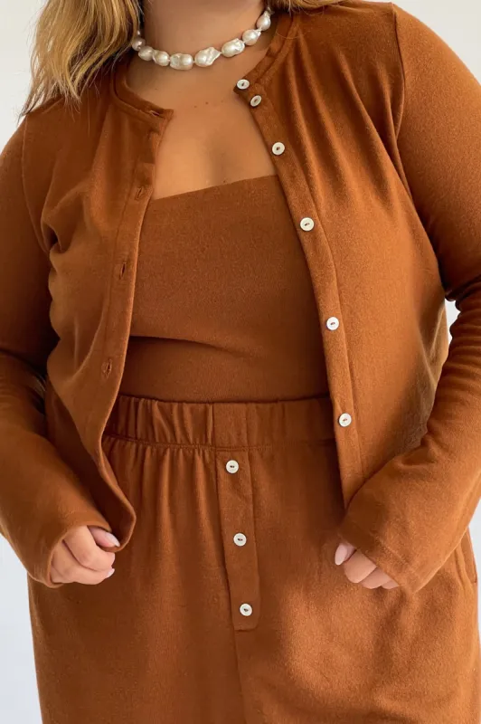 sweater cardi sold by DONNI.