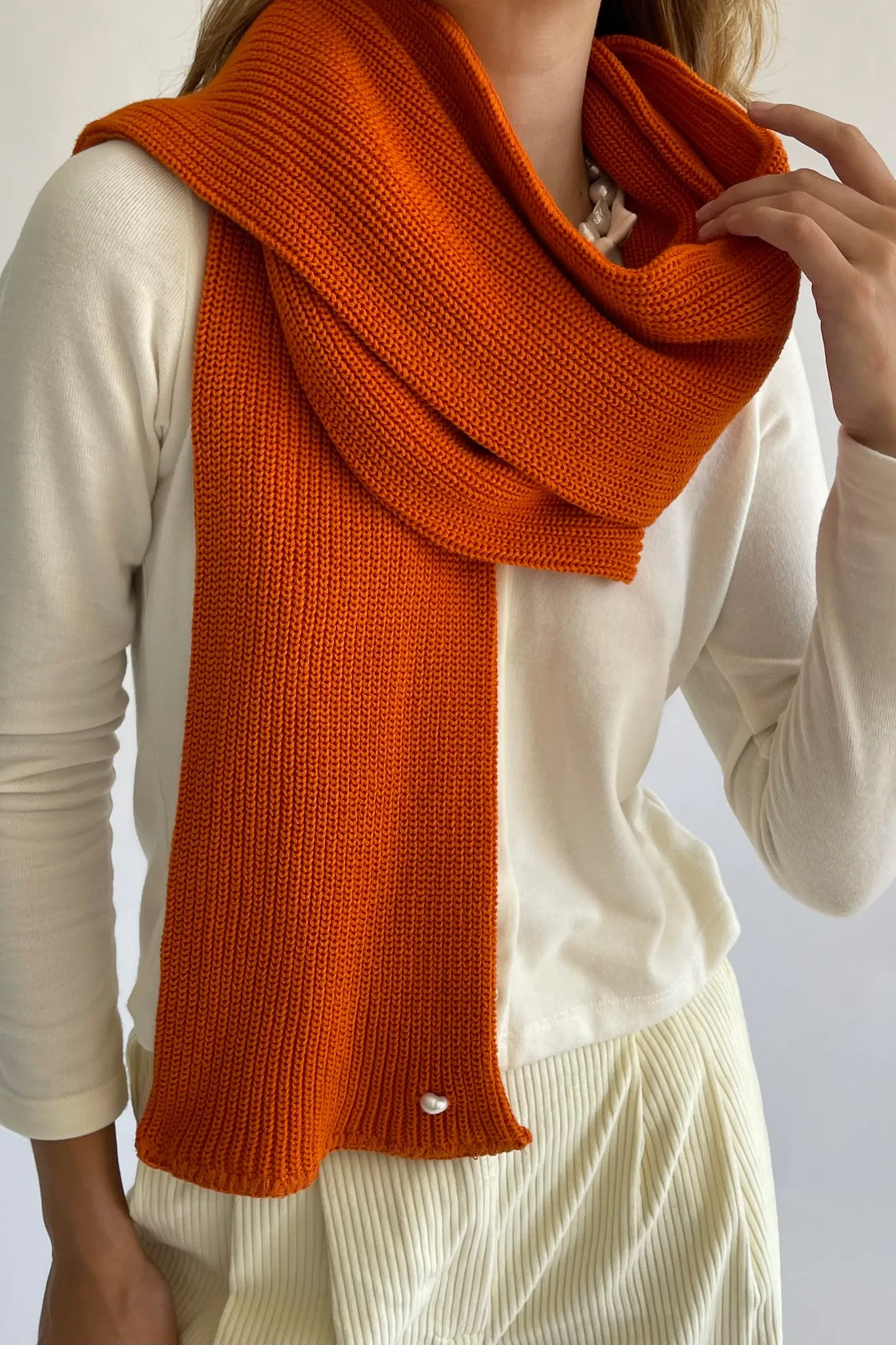 pearl scarf sold by DONNI.