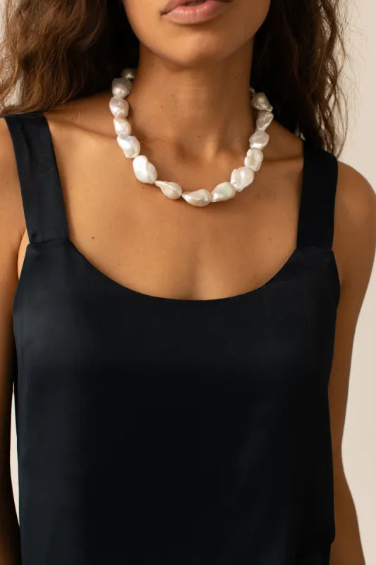 The Satiny Cami sold by DONNI.