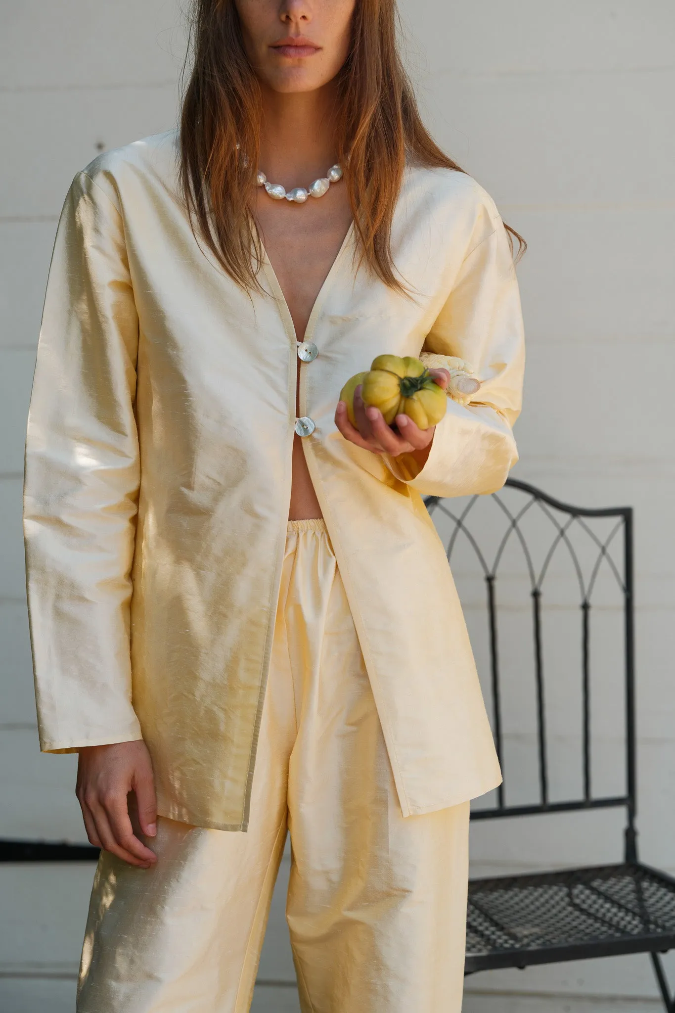 The Taffeta Split Top sold by DONNI.