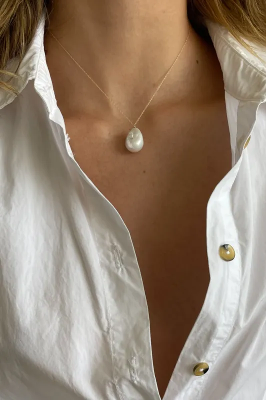 The June 16" White Pearl Necklace sold by DONNI.