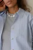 The Pop Button Down sold by DONNI.