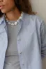 The Pop Button Down sold by DONNI.