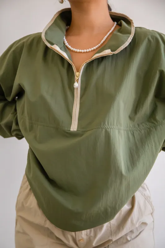 nylon 1/2 zip sold by DONNI.