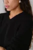 The Cotton Cashmere V-Neck Sweater sold by DONNI.