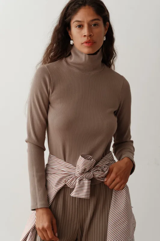 The Rib Turtleneck sold by DONNI.