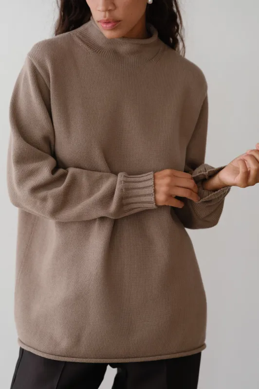 The Cotton Cashmere Roll Neck Sweater sold by DONNI.