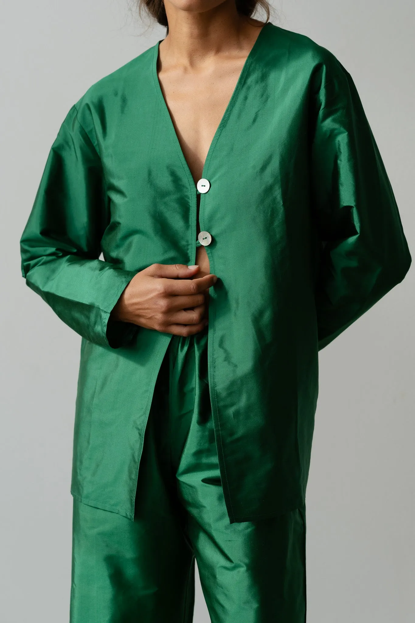 The Taffeta Split Top sold by DONNI.