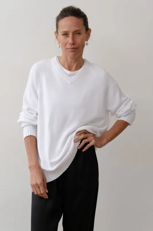 The Cotton Knit V-Neck Sweater sold by DONNI.