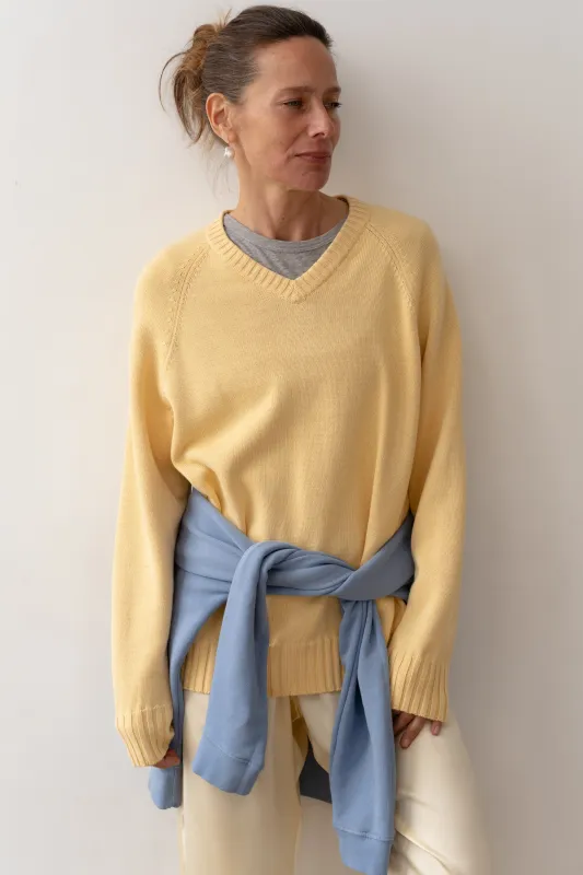 The Cotton Knit V-Neck Sweater sold by DONNI.
