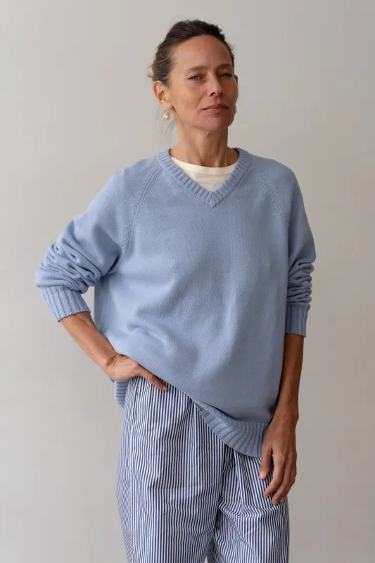 The Cotton Knit V-Neck Sweater sold by DONNI.