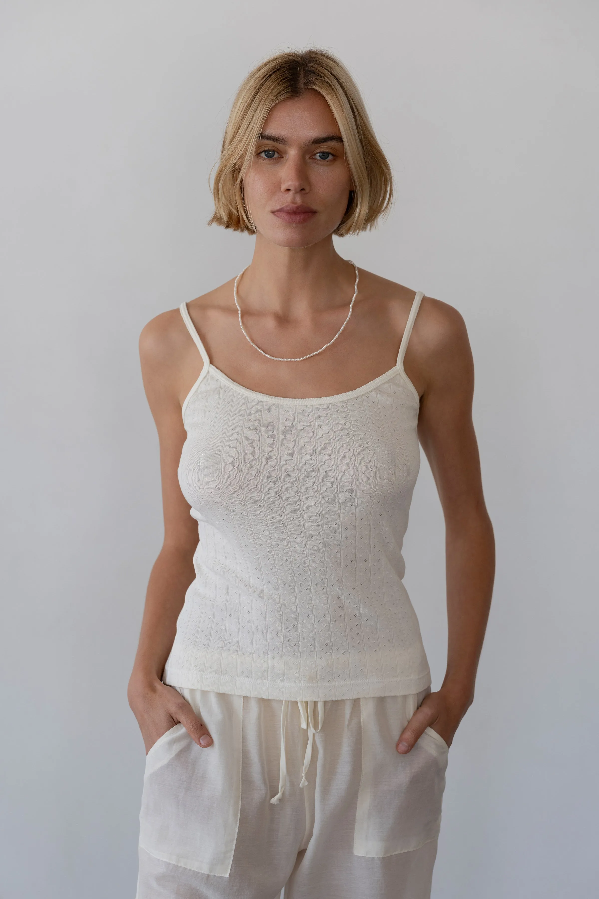 The Pointelle Cami Tank sold by DONNI.