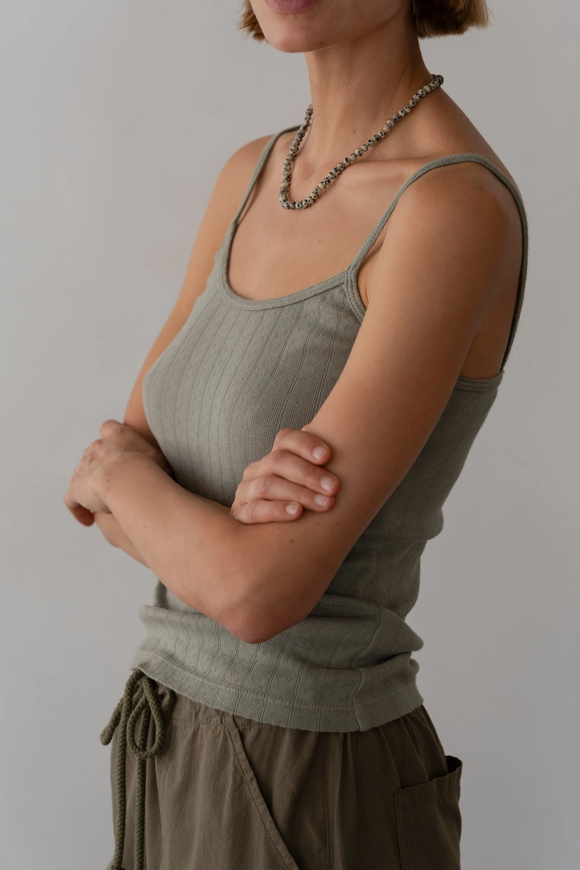 The Pointelle Cami Tank sold by DONNI.