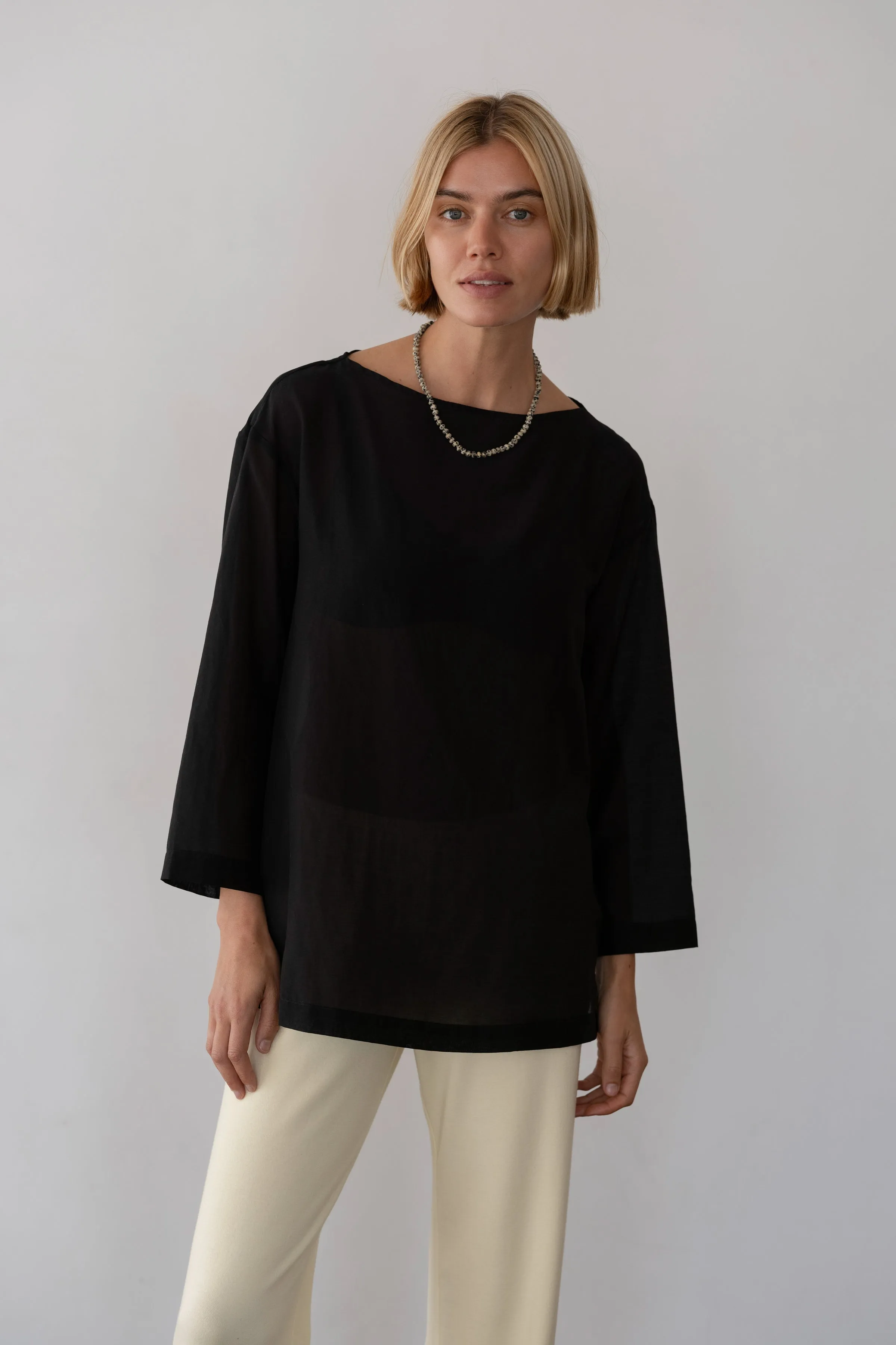The Silk Cotton Sheer Boatneck sold by DONNI.