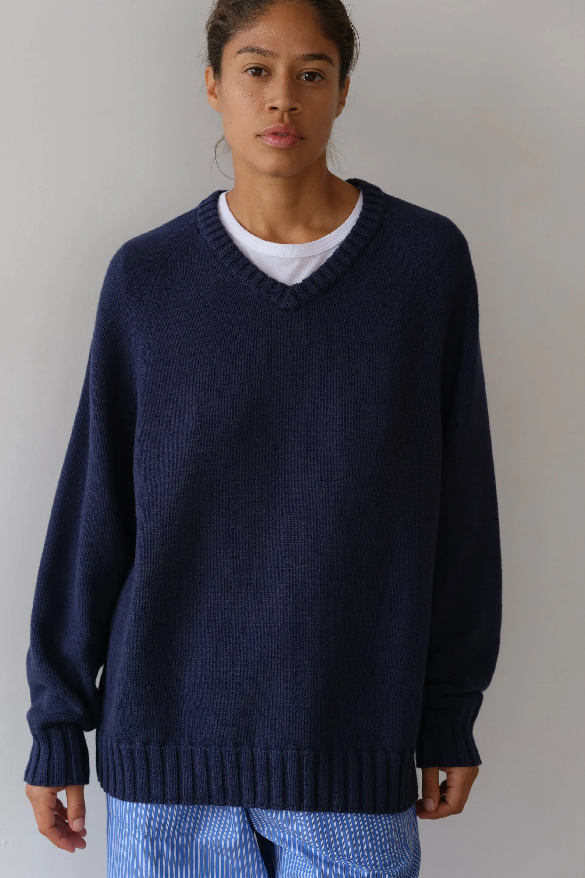 The Cotton Cashmere V-Neck Sweater sold by DONNI.