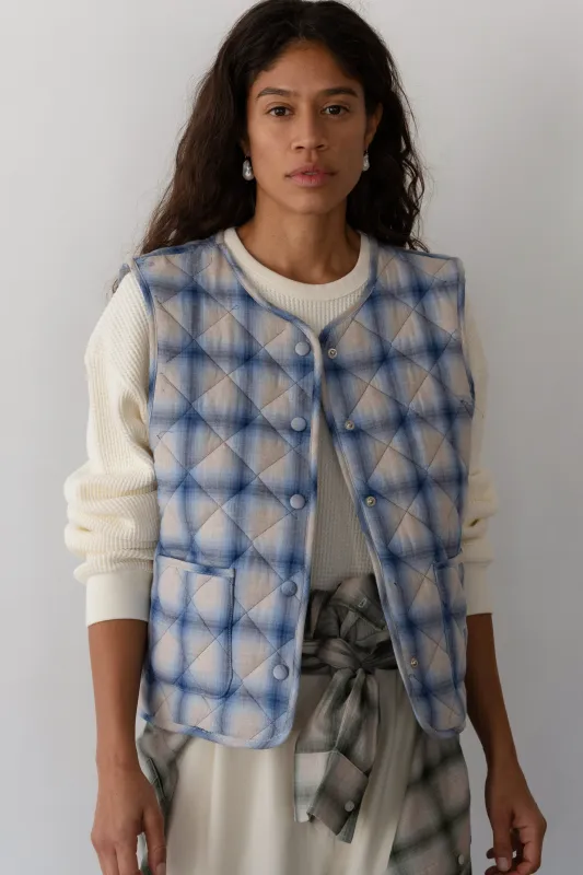The Quilted Plaid Flannel Vest sold by DONNI.