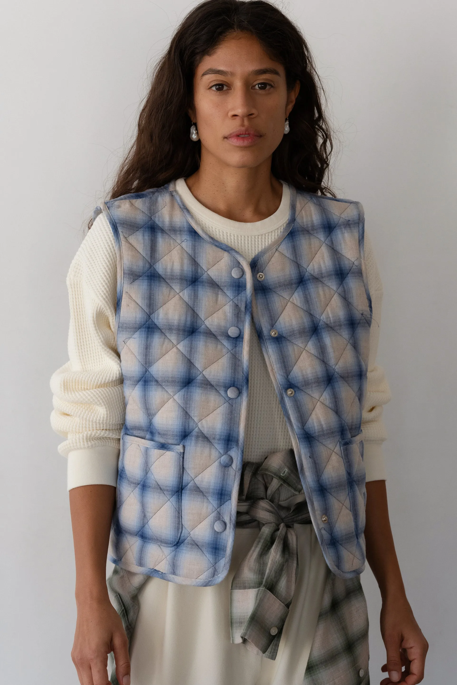 The Quilted Plaid Flannel Vest sold by DONNI.