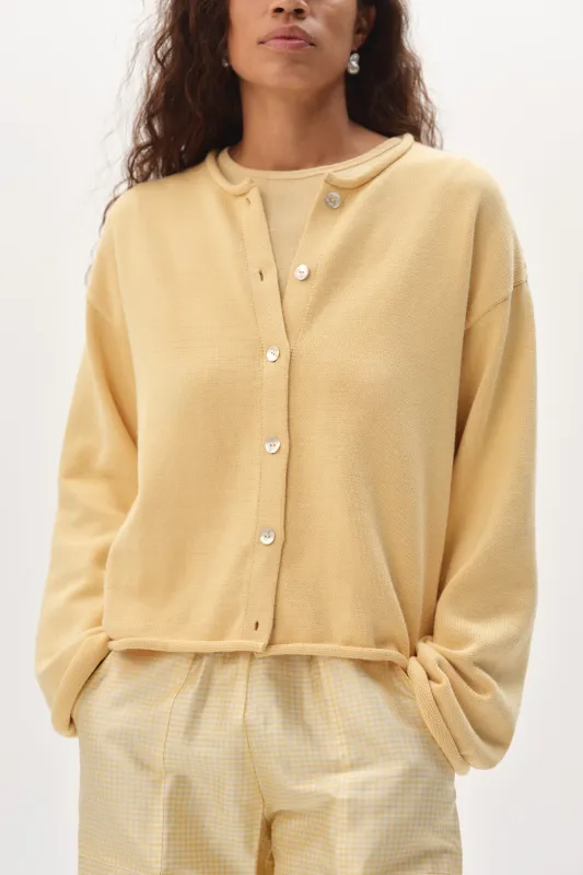 The Cotton Knit Roll Cardigan sold by DONNI.