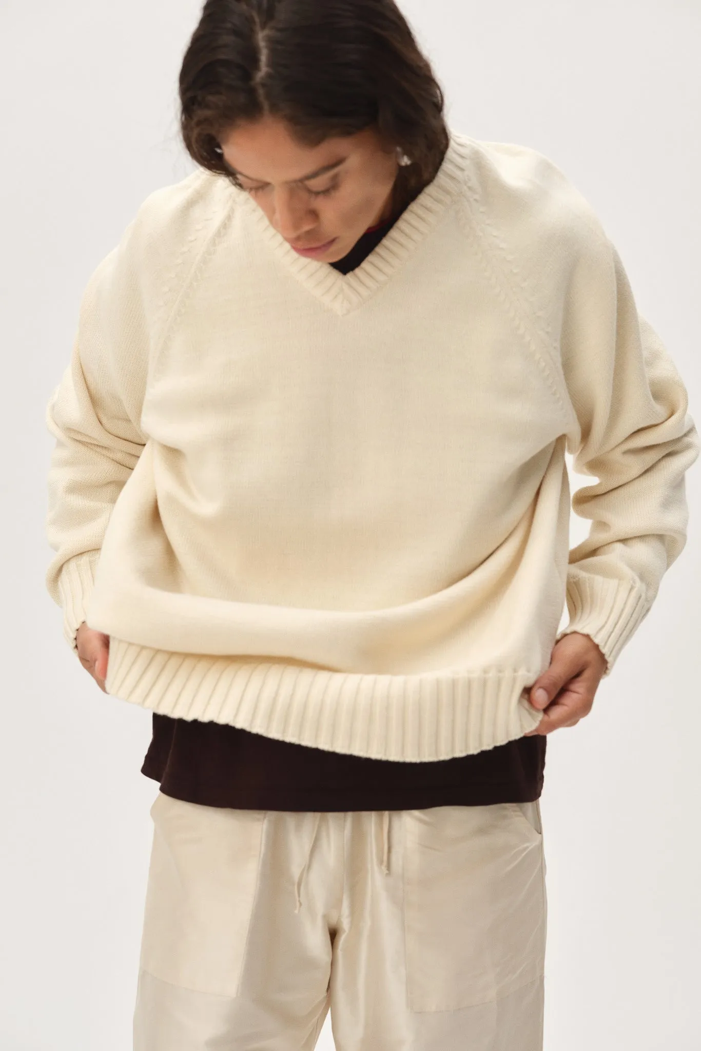 The Cotton Knit V-Neck Sweater sold by DONNI.