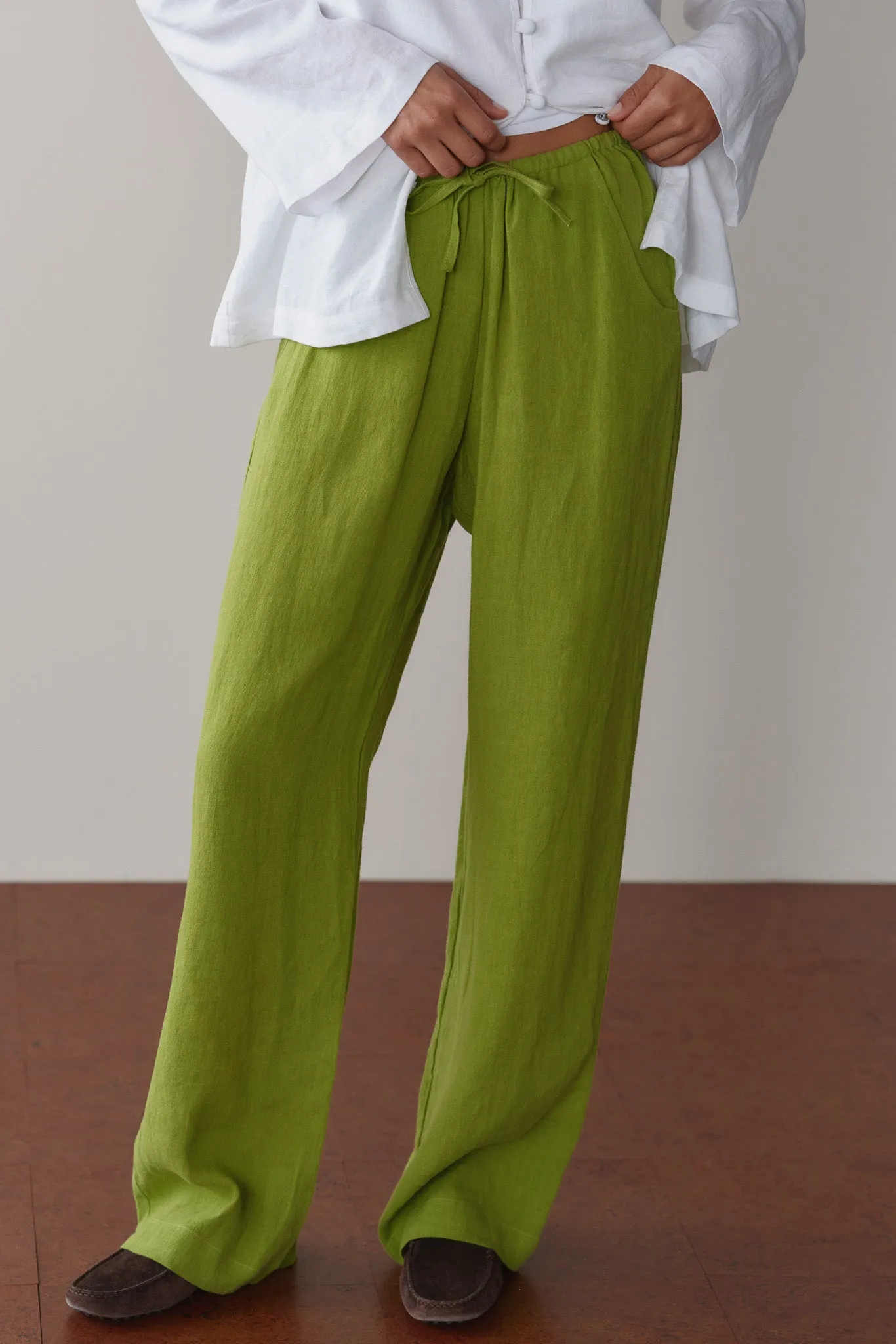The Linen Drawstring Pant Pistachio sold by DONNI.