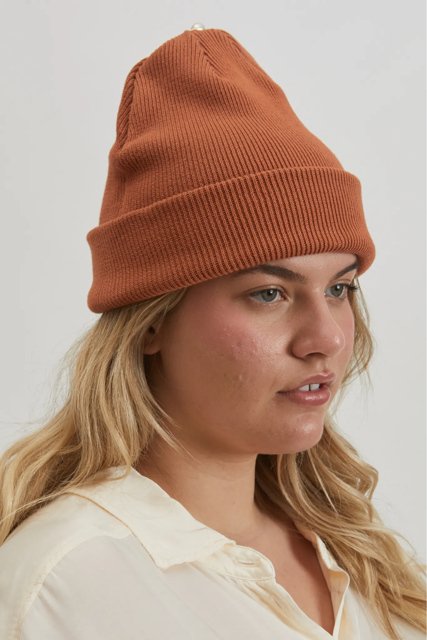 pearl beanie sold by DONNI.