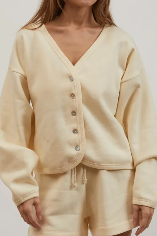 eco-fleece cardi sold by DONNI.