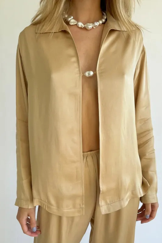 silky baroque pearl top sold by DONNI.