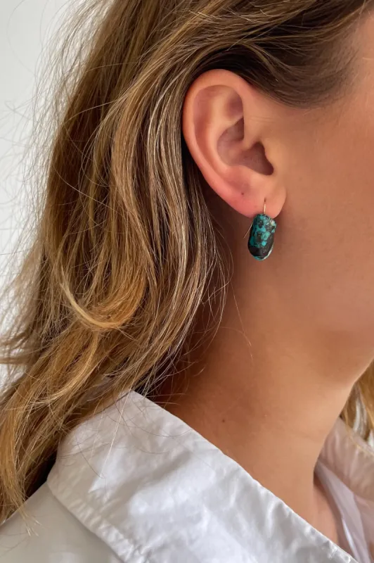 The Turquoise Drop Earrings sold by DONNI.