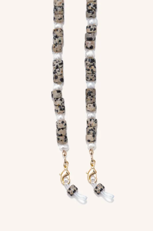 gem + pearl mask/sunny chain sold by DONNI.