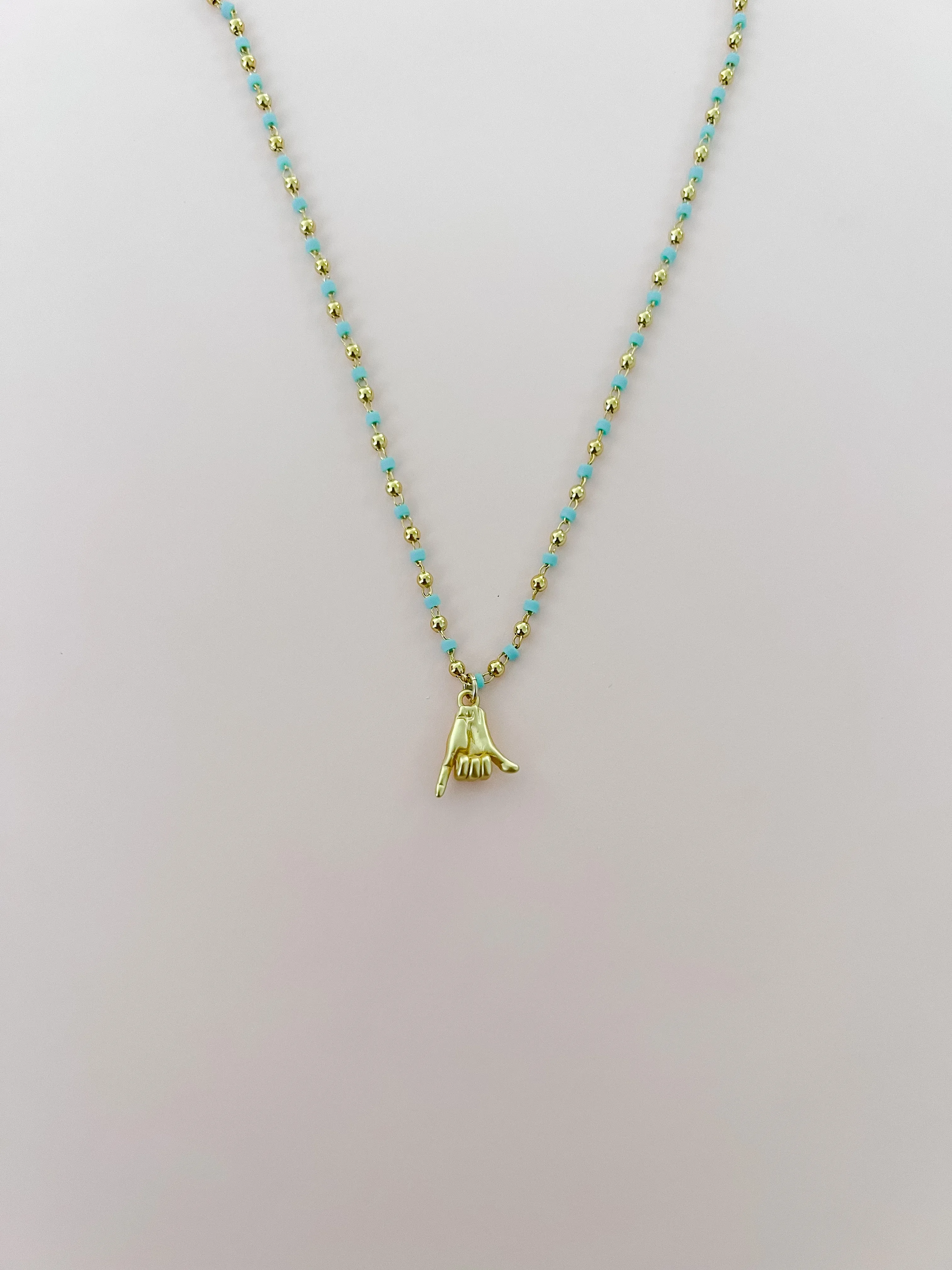 Mini Gold Shaka Necklace sold by Mermaid & Me