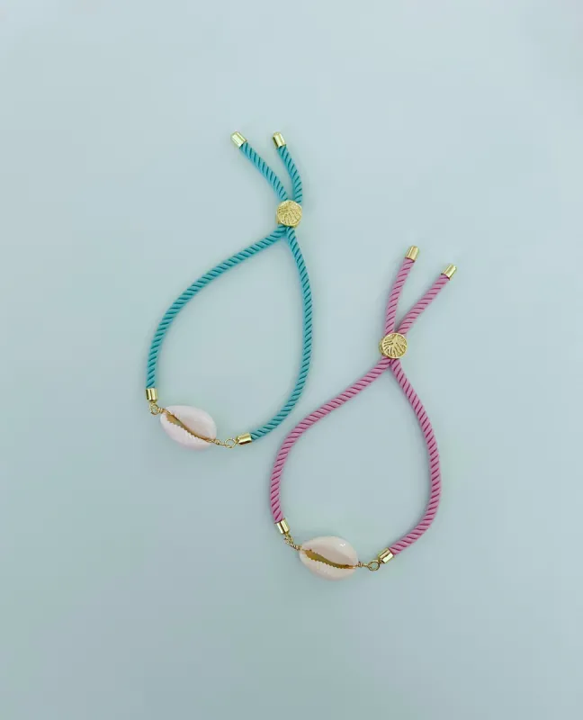 Pink or Teal Rope Cowrie Shell Bracelet sold by Mermaid & Me