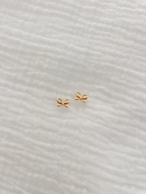 Tiny Gold Bow Stud Earrings sold by Mermaid & Me