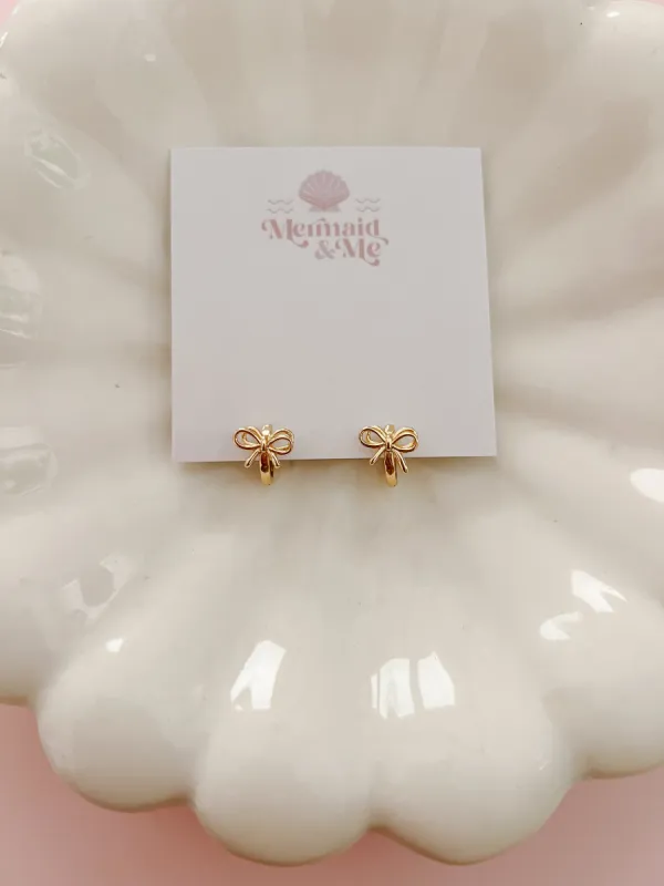 Gold Tiny Bow Huggie Earrings sold by Mermaid & Me