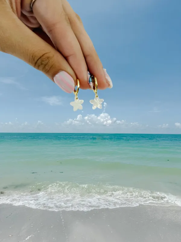 Tiny Mother of Pearl Plumeria Earrings sold by Mermaid & Me