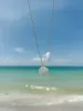 Mother of Pearl Hibiscus Necklace sold by Mermaid & Me