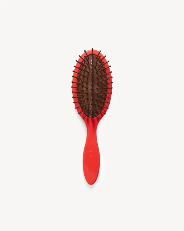 Travel Detangling Hair Brush in Ruby sold by Machete