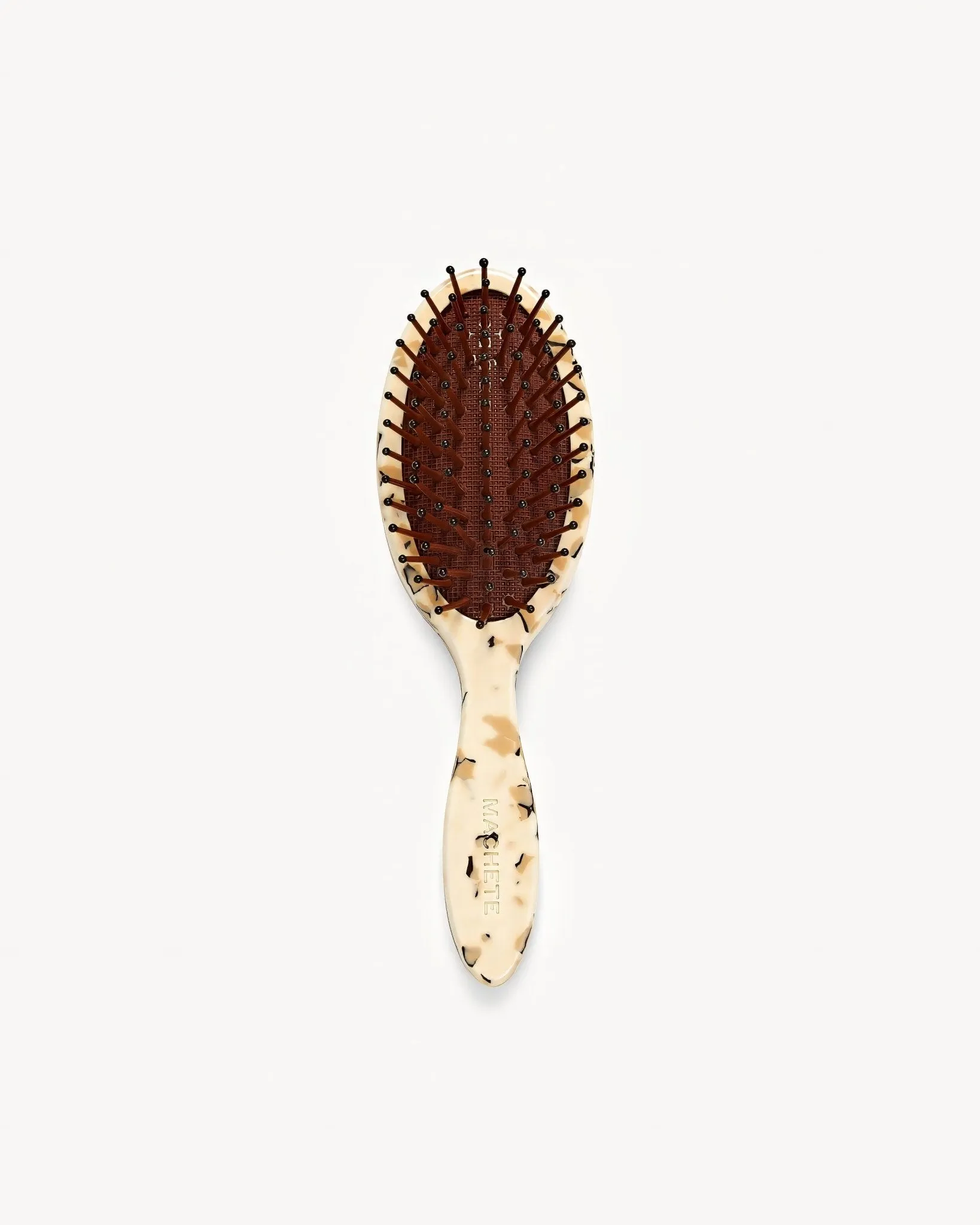 Travel Detangling Hair Brush in Terrazzo sold by Machete