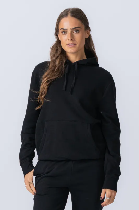 Essential Hoodie - Sort sold by Teeshoppen