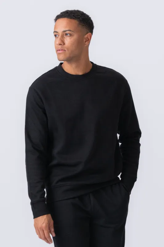 Essential Crewneck - Sort sold by Teeshoppen