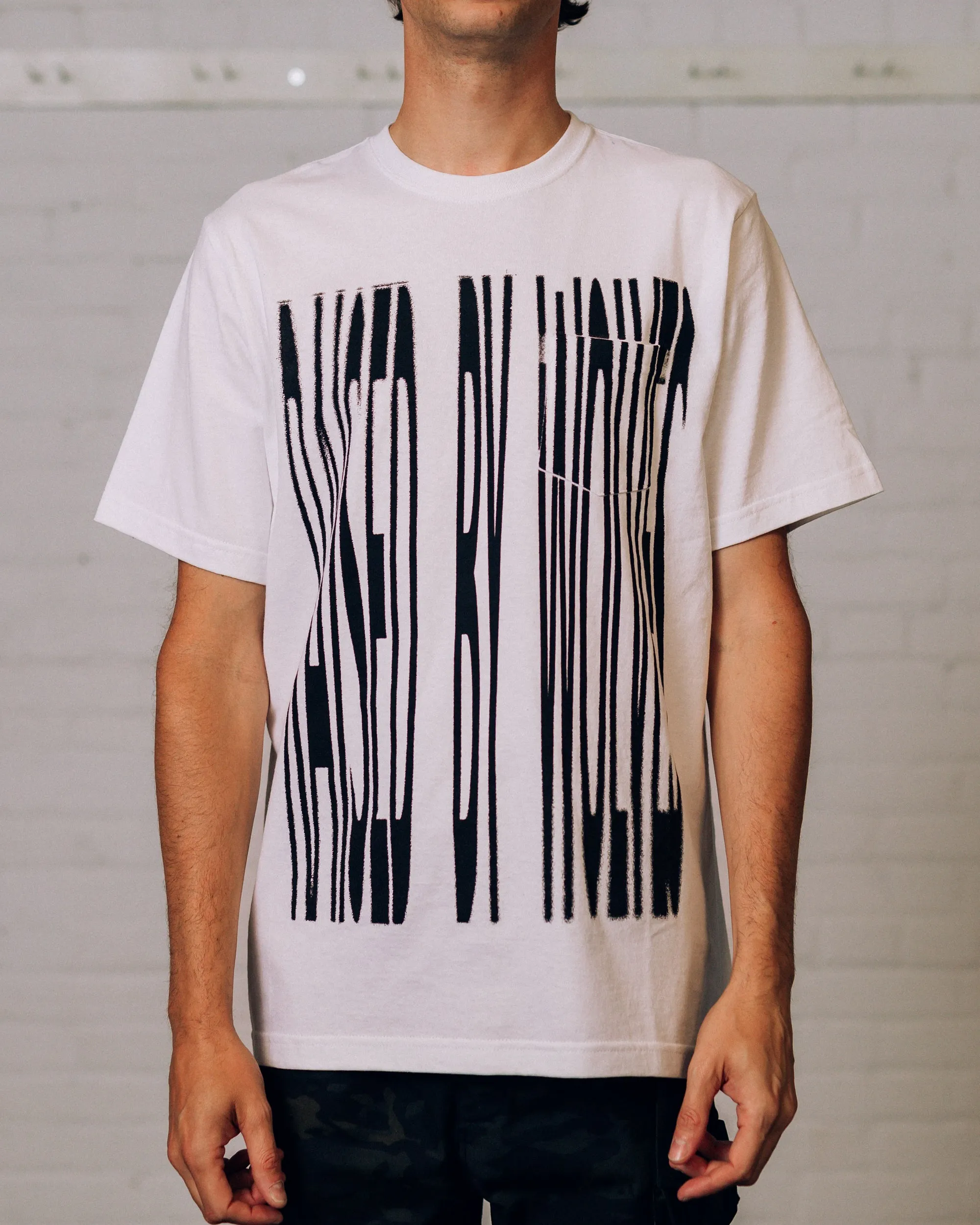 Stretch Pocket Tee sold by Raised by Wolves